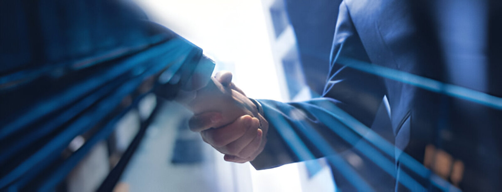 A business handshake over an Abu Dhabi skyline